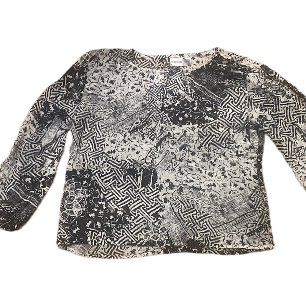 Chico’s silk black and white sheer patterned blouse with tie at neck